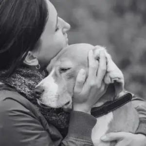 When a pet dies, pet loss, woman hugging dog